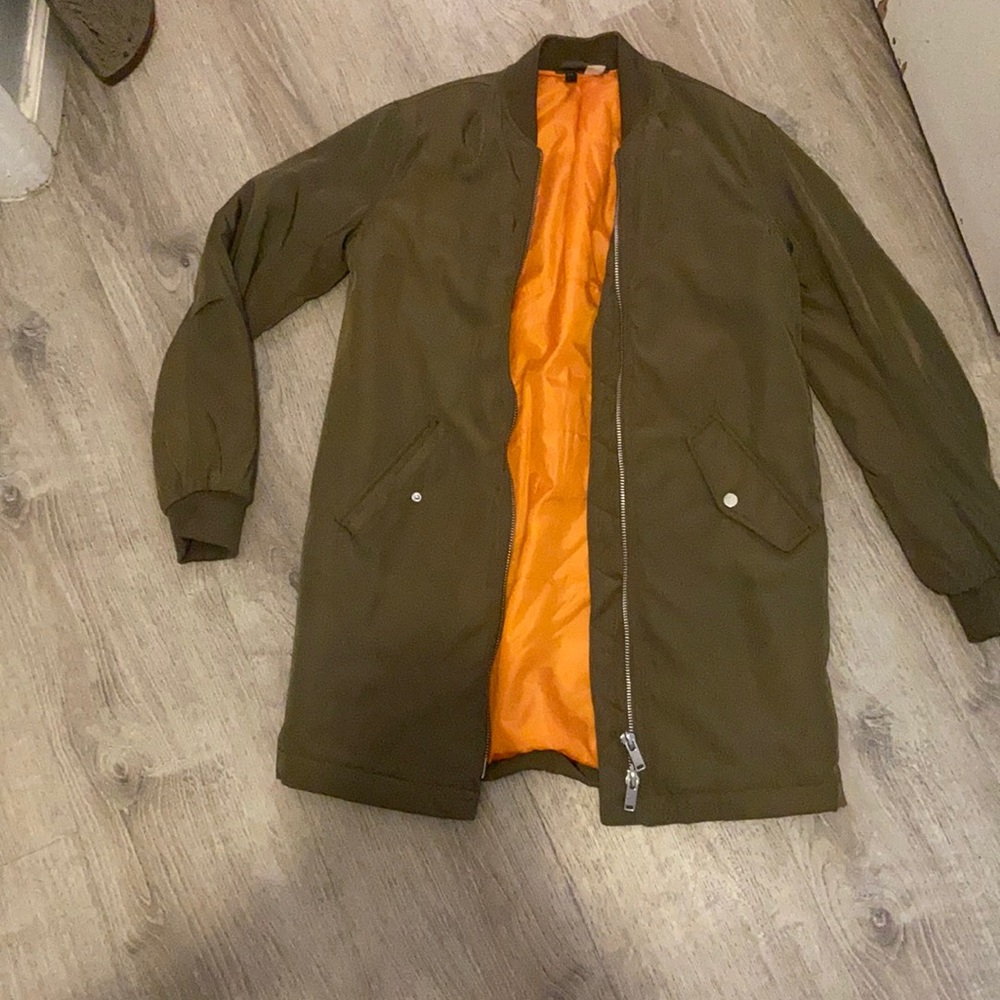A green Long Street wear a jacket